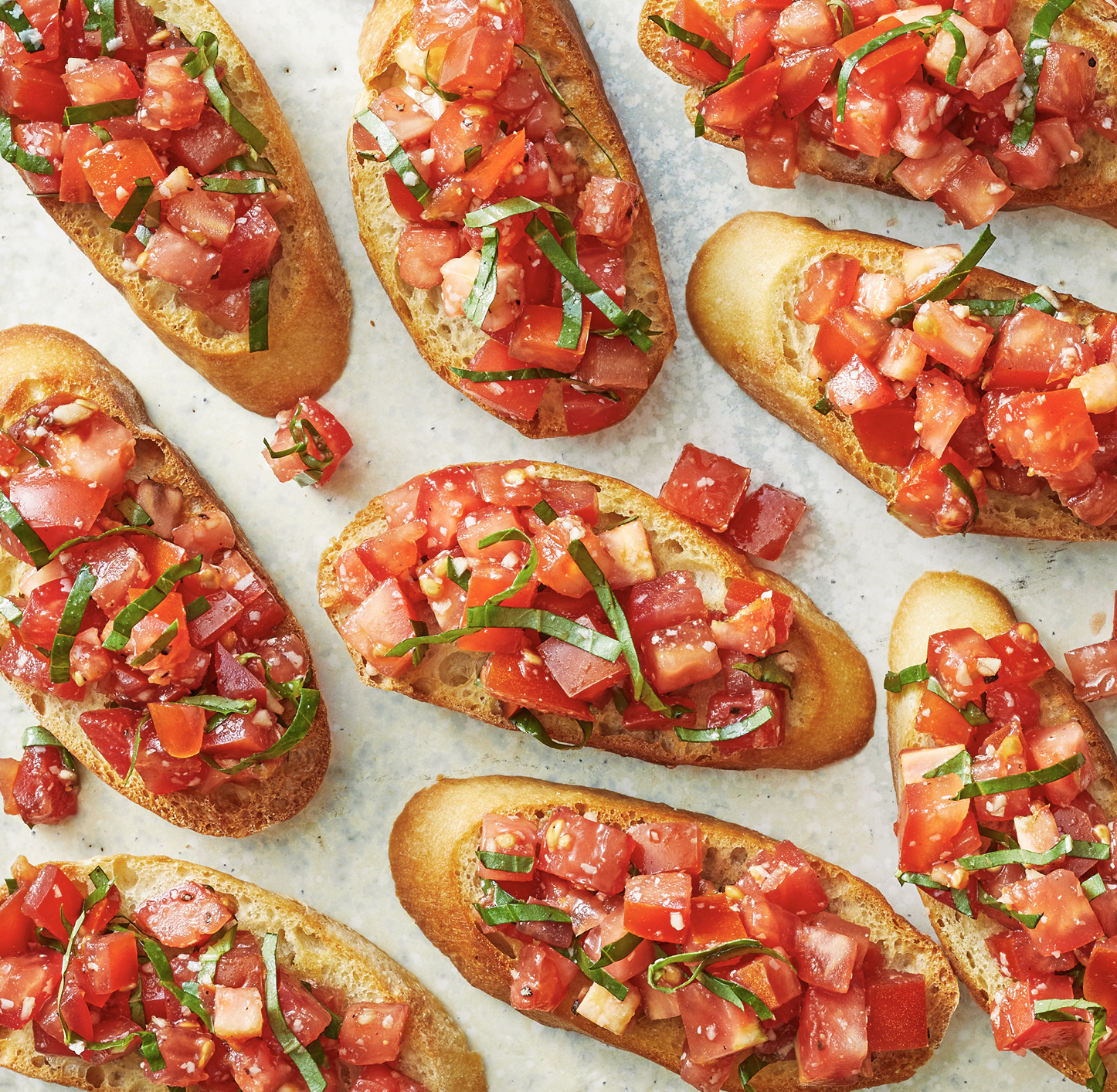 Many bruschetta with diced tomatoes